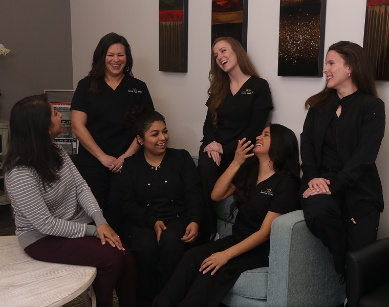 The Fulshear Dental team laughing togehter